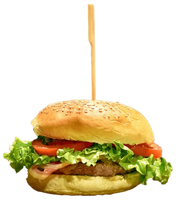 Burger with lettuce, tomato and bacon in a sesame seed bun with a wooden skewer
